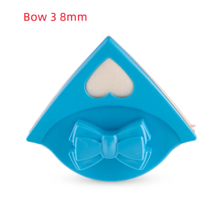 Blue paper punch with bow design on a white background